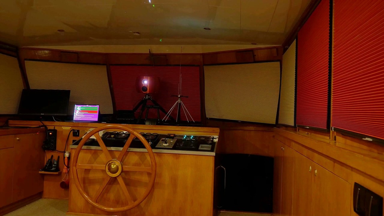 The apparatus before the projection: a projector and a camera on tripods facing the scene